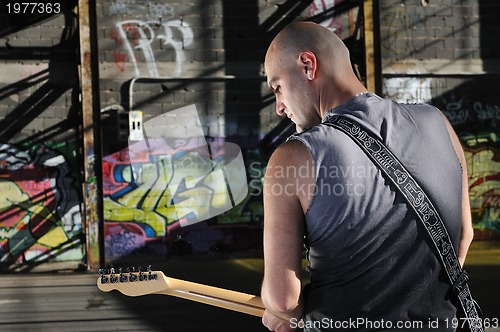 Image of music guitar player outdoor 