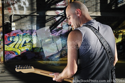 Image of music guitar player outdoor 