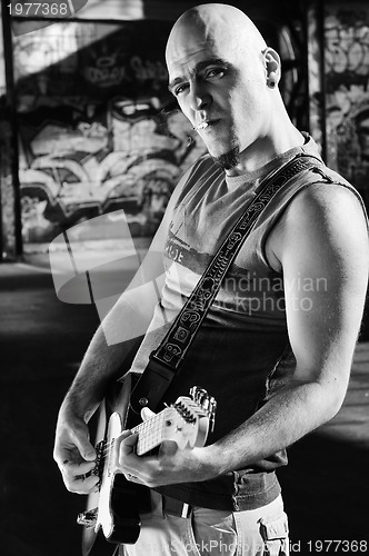 Image of music guitar player outdoor 