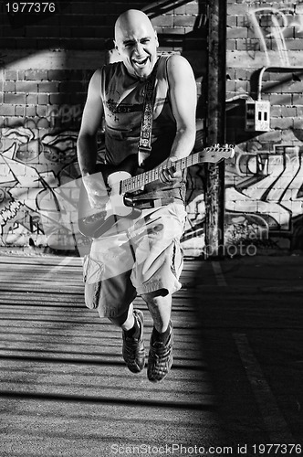 Image of music guitar player outdoor 