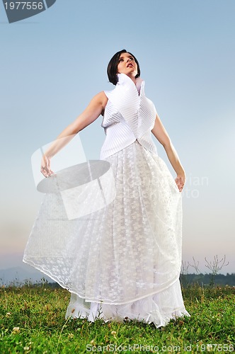 Image of beautiful bride outdoor after wedding ceremny