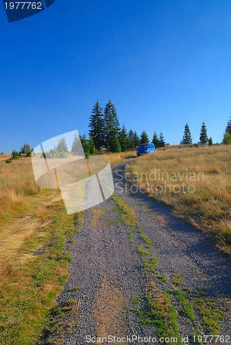 Image of blue van in nature