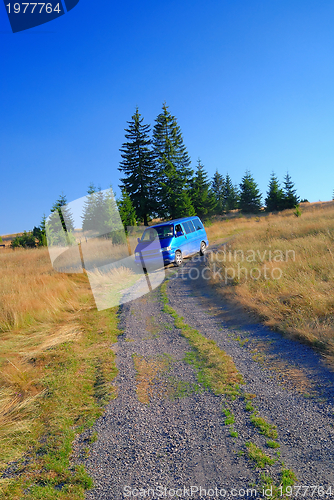 Image of blue van in nature