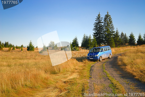 Image of blue van in nature