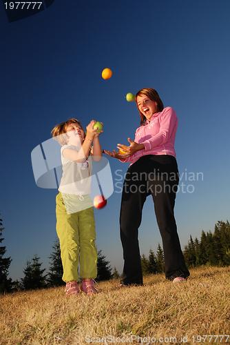 Image of Food balancing concept with girls in nature