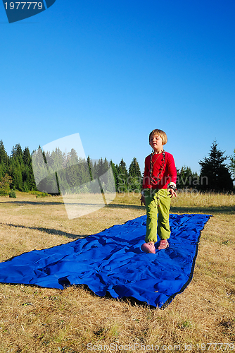 Image of model imitation on blue carpet