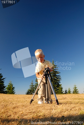 Image of little boy with tripod