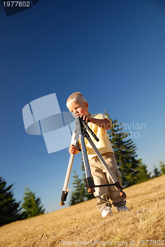 Image of little boy with tripod