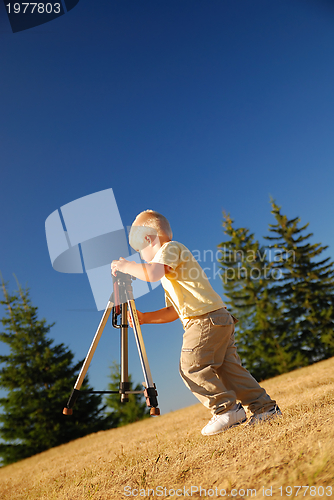 Image of little boy with tripod