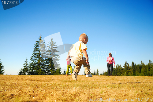 Image of mother and kids having fun outside