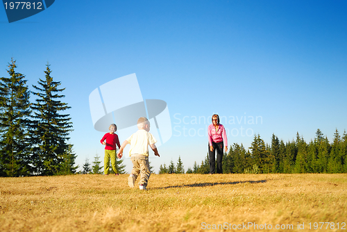 Image of mother and kids having fun outside