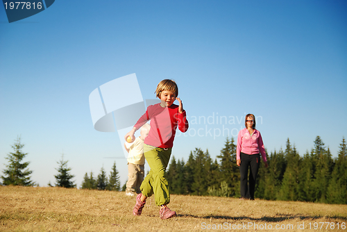 Image of mother and kids having fun outside