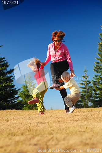 Image of mother and kids having fun outside