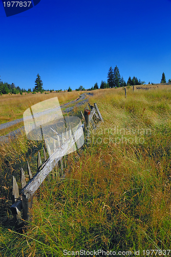 Image of old fence and idilic landscape