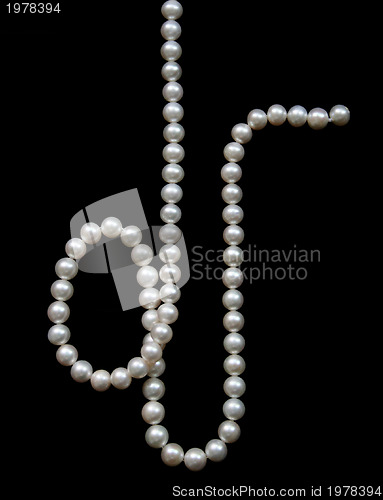 Image of White pearls on the black velvet  background