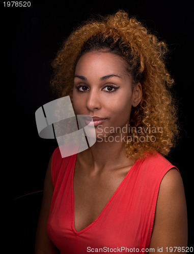 Image of portrait of a young woman in a low-key