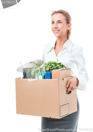 Image of Portrait of business woman holding a box with her belongings