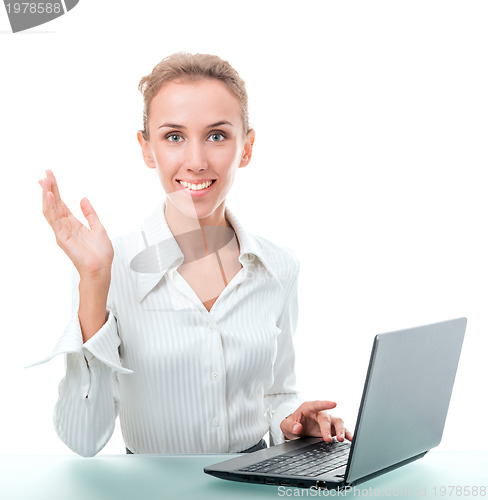 Image of friendly administrative assistant at the desk with a laptop