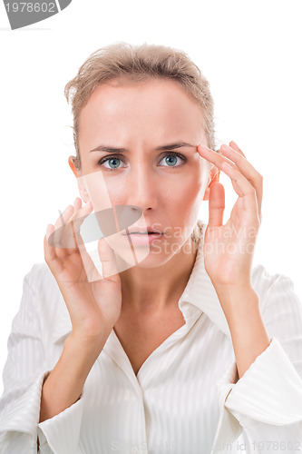 Image of Portrait of a woman, peering hard into the mirrorPortrait of a w