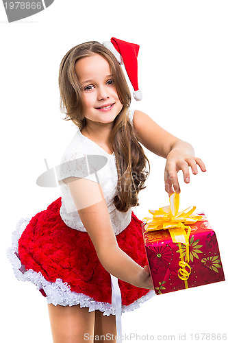 Image of girl with red Christmas cap and present on isolated white