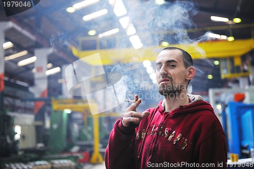 Image of industry worker smoke cigarette