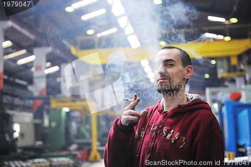 Image of industry worker smoke cigarette