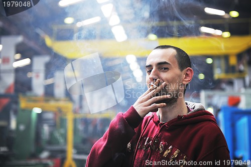 Image of industry worker smoke cigarette