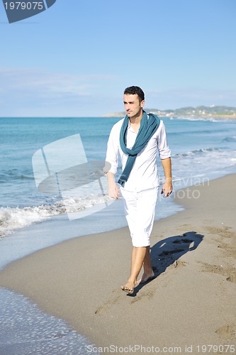 Image of happy young woman on beach