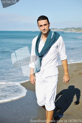 Image of young man at beach
