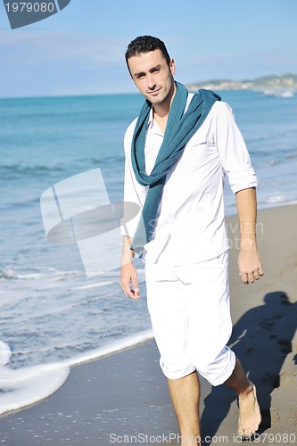 Image of young man at beach