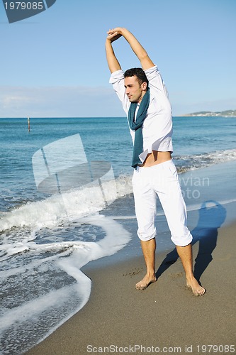 Image of young man at beach
