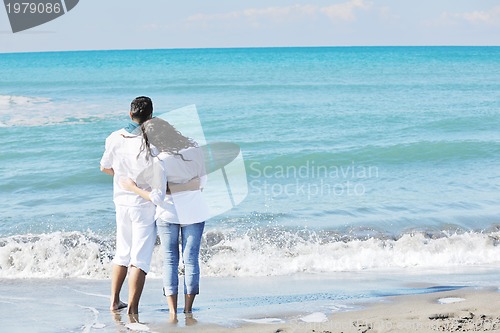 Image of happy young couple have fun at beautiful beach