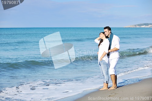 Image of happy young couple have fun at beautiful beach