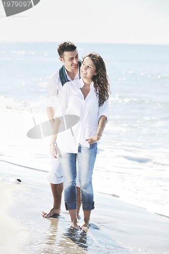 Image of happy young couple have fun at beautiful beach