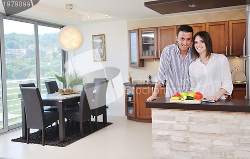 Image of happy young couple have fun in modern kitchen