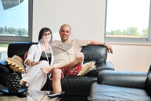Image of happy young couple relax at home