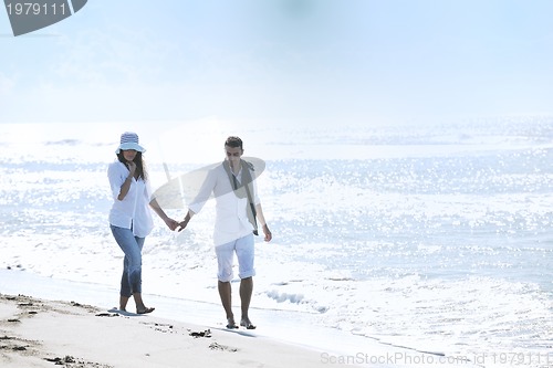 Image of happy young couple have fun at beautiful beach
