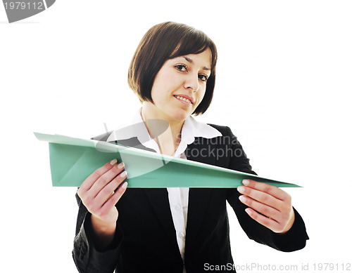 Image of business woman throwing  paper airplane 