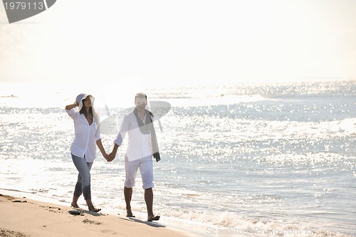 Image of happy young couple have fun at beautiful beach