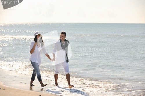 Image of happy young couple have fun at beautiful beach