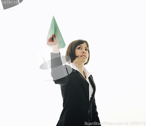 Image of business woman throwing  paper airplane 