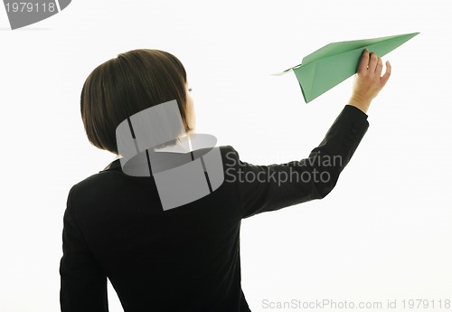 Image of business woman throwing  paper airplane 