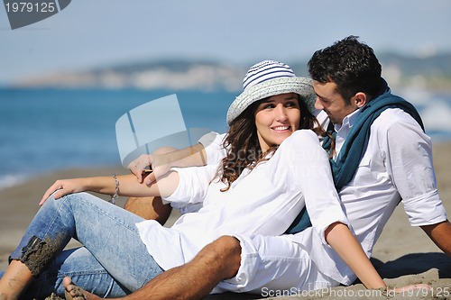 Image of happy young couple have fun at beautiful beach