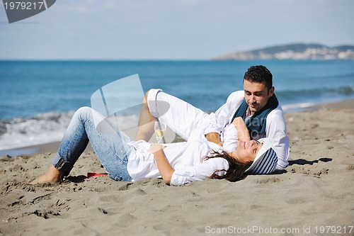 Image of happy young couple have fun at beautiful beach