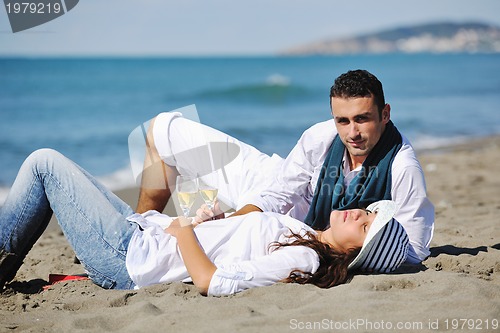 Image of happy young couple have fun at beautiful beach