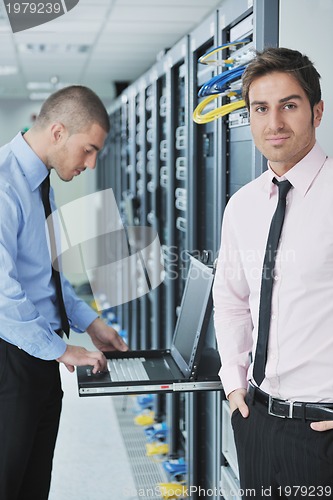 Image of it engineers in network server room