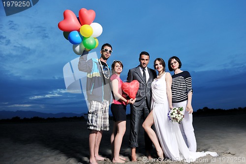 Image of happy young  people group have fun on beach