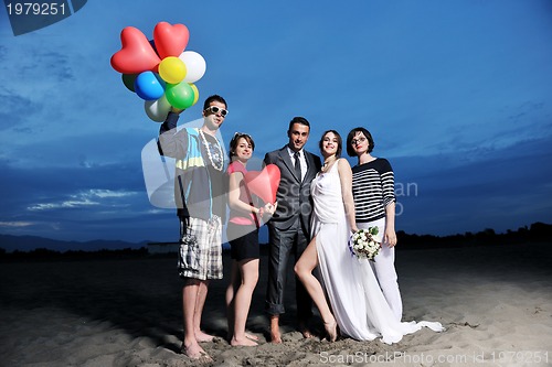 Image of happy young  people group have fun on beach