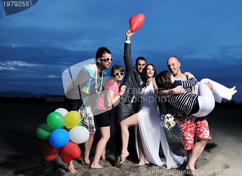 Image of happy young  people group have fun on beach