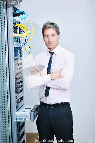 Image of young it engeneer in datacenter server room